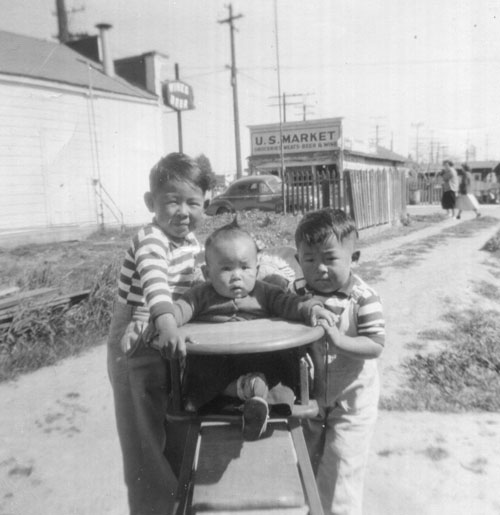 Gary, Shuji, and Kenny in front of their house