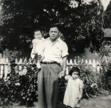 Hong Wong holding Judy Wong and with Helen Wong