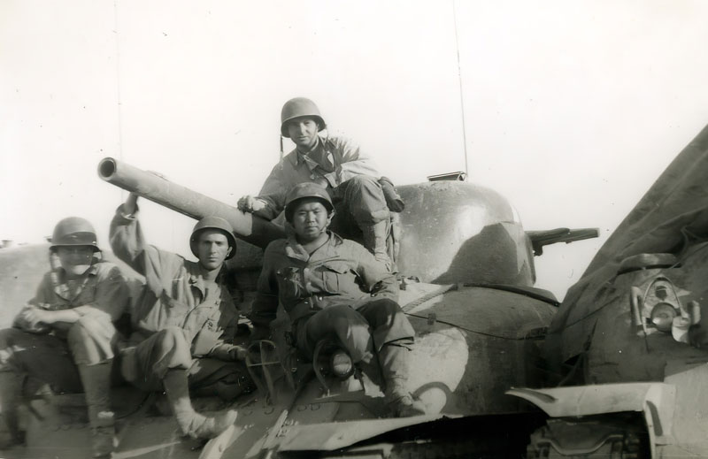 Joe Mori atop tank at Fort Knox