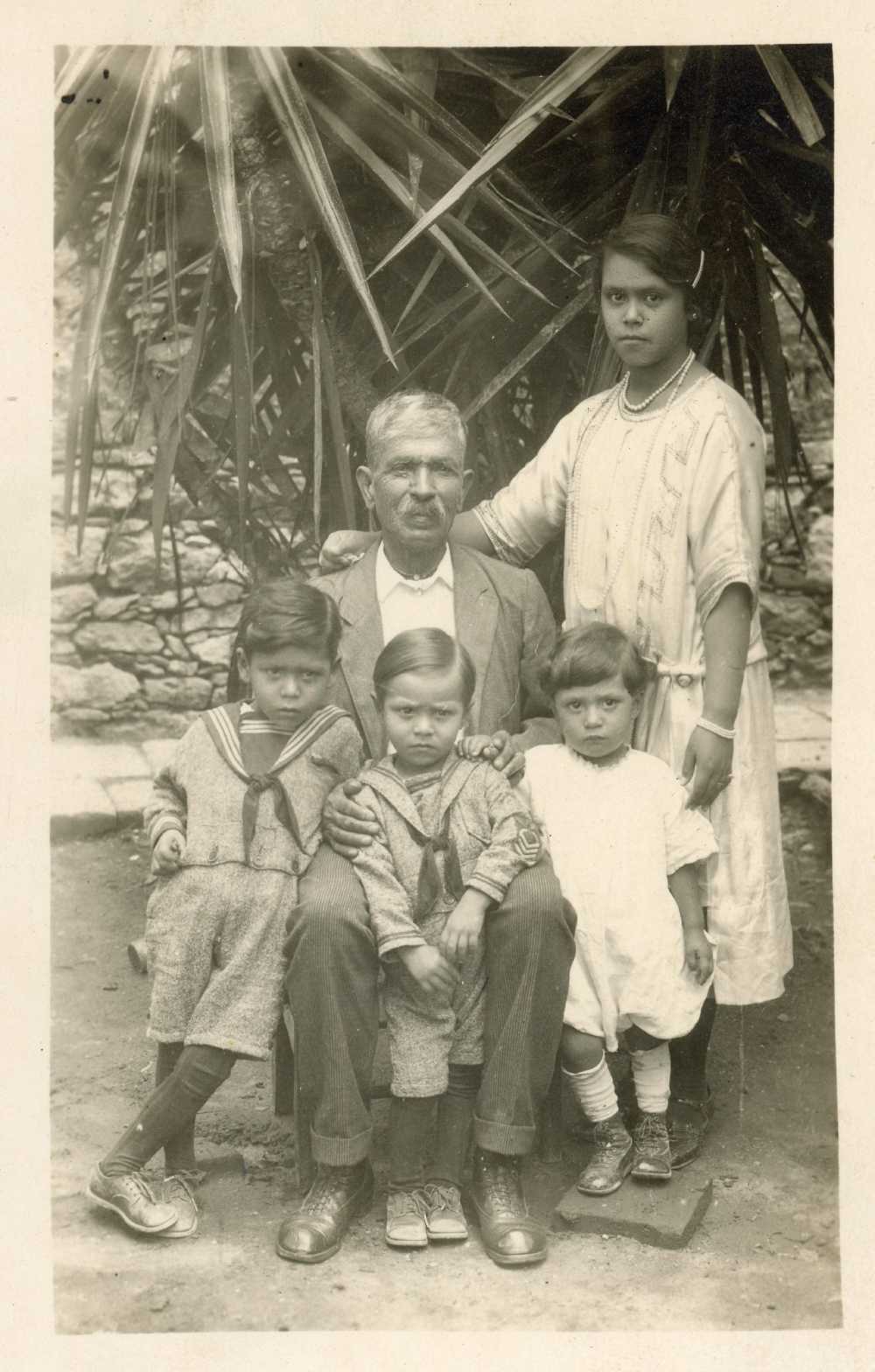 Merced with sons Antonio, Pedro, and Gennaro and a young woman